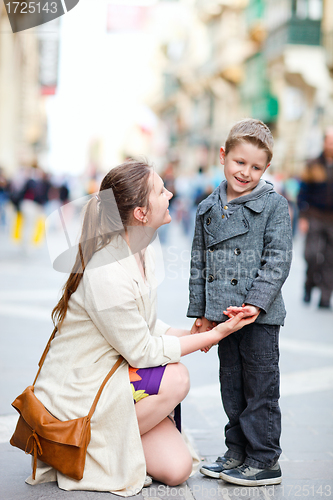 Image of Mother and son outdoors in city