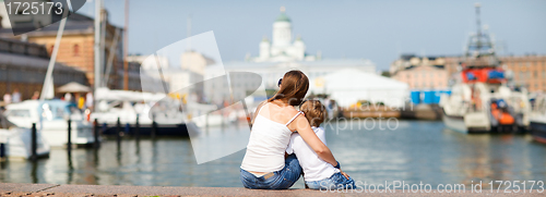 Image of Panoramic photo of mother and son enjoying views of city center