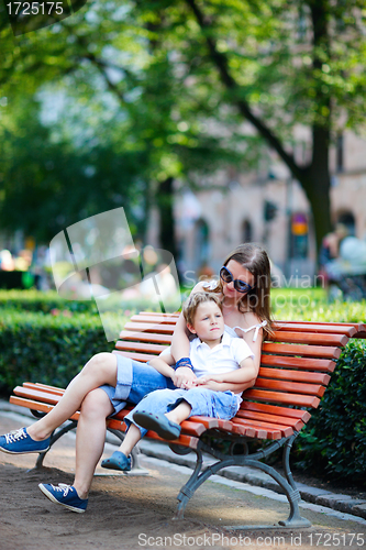 Image of Mother and son sitting outdoors