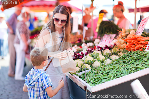 Image of Mother and son at market