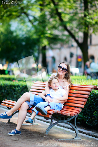 Image of Mother and son on bench in park