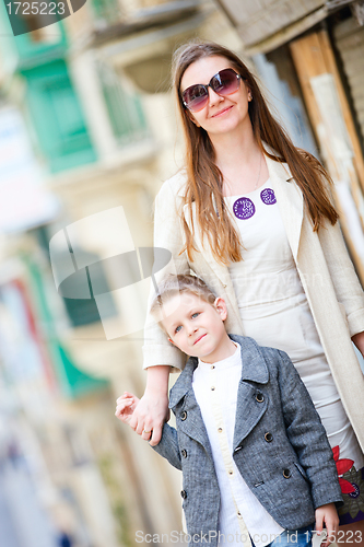 Image of Mother and son outdoors in city