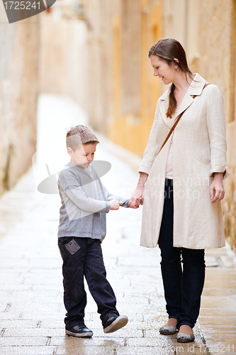 Image of Mother and son outdoors in city