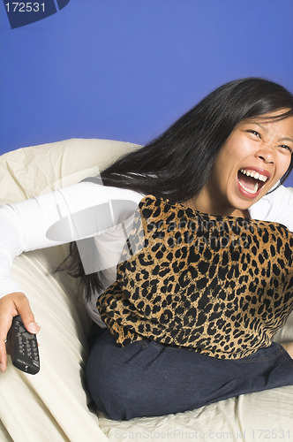 Image of laughing watching tv