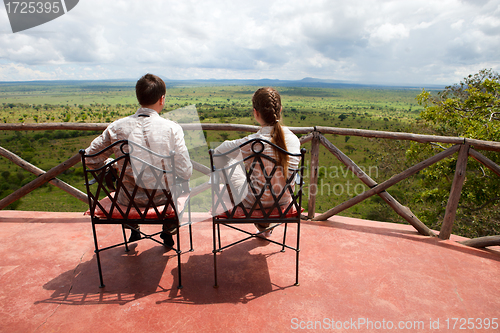 Image of Couple on balcony of safari lodge