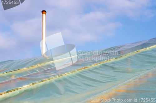 Image of Film greenhouses with the chimney