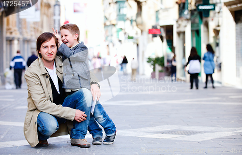 Image of Father and son in city