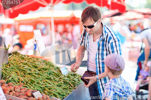Image of Father and son at market