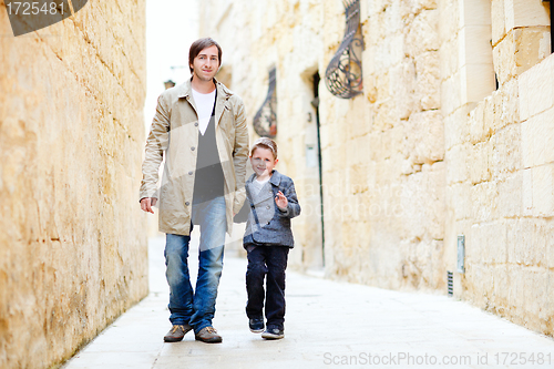 Image of Father and son in city