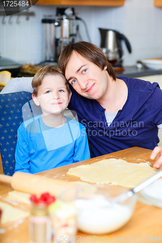 Image of Father and son baking