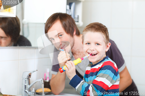 Image of Father and son brushing teeth