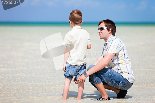 Image of Father and son at shallow water