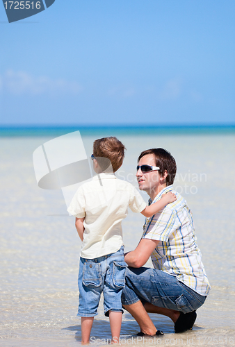 Image of Father and son at shallow water