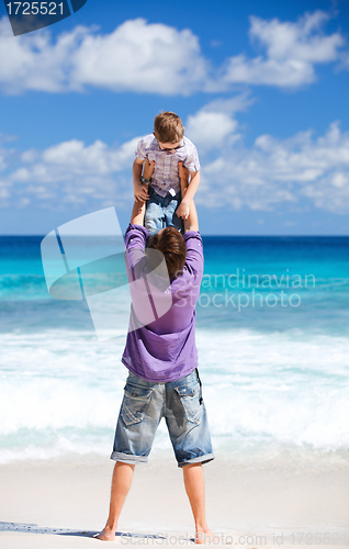 Image of Father and son on beach vacation