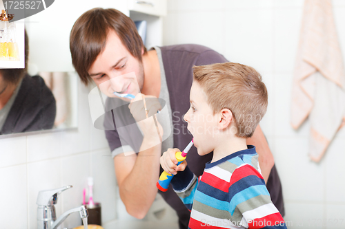 Image of Father and son brushing teeth