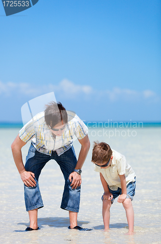 Image of Father and son at shallow water