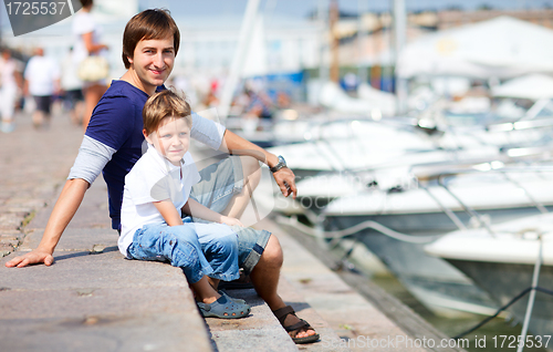 Image of Father and son at marina in city center