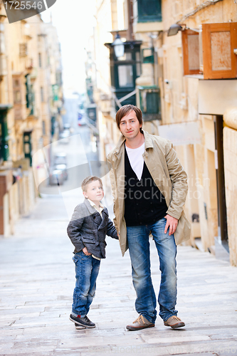 Image of Father and son in city