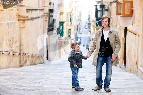 Image of Father and son in city