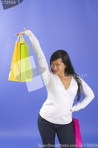 Image of woman holding shopping bags