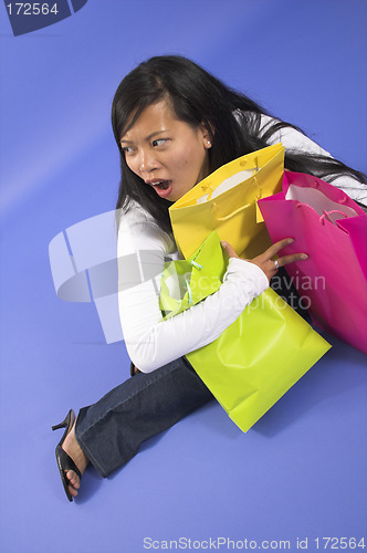 Image of woman holding shopping bags