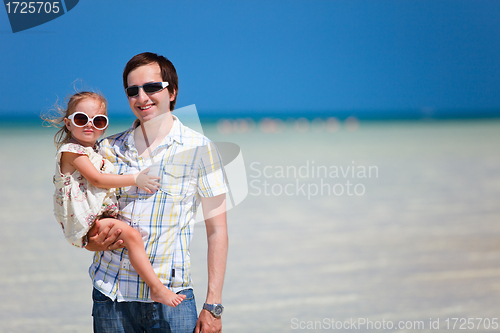 Image of Father and daughter at shallow water