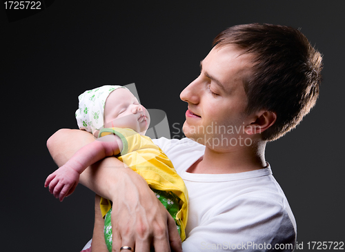 Image of Happy young father and newborn girl