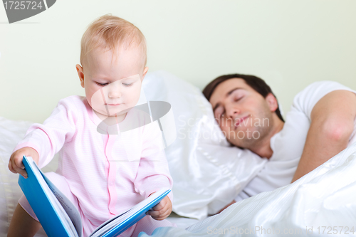 Image of Baby reading to father