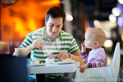 Image of Father and daughter in cafe