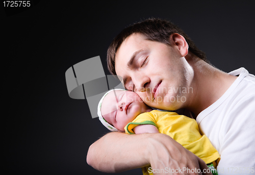 Image of Happy young father and newborn girl