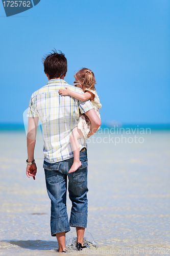 Image of Father and daughter at shallow water