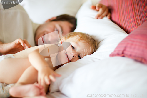 Image of Father and daughter in bedroom