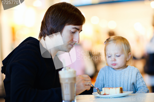 Image of Father and daughter at cafe