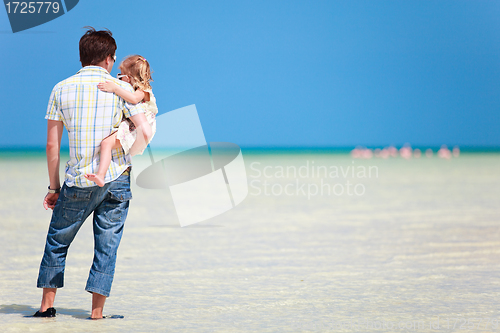Image of Father and daughter at shallow water