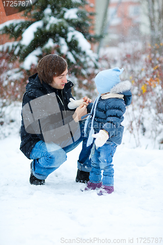 Image of Father and daughter outdoors at winter