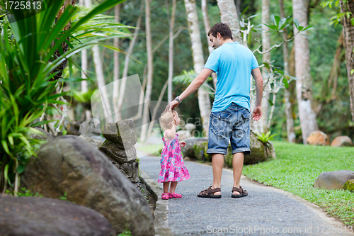 Image of Father and little daughter at tropical park