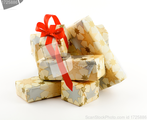 Image of Stack of Gift Boxes and one with Red Bow