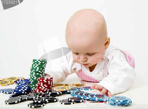 Image of Baby playing poker chips