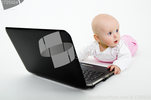 Image of Baby girl with a laptop