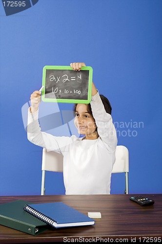 Image of little girl showing chalkboard