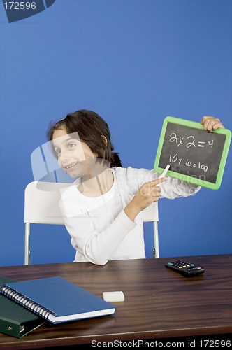 Image of little girl showing chalkboard