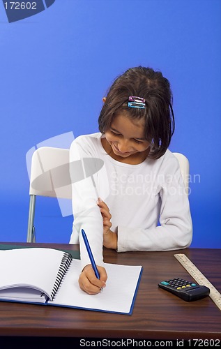 Image of little girl writting