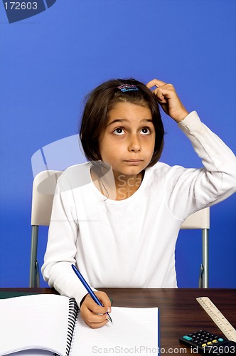 Image of little girl working