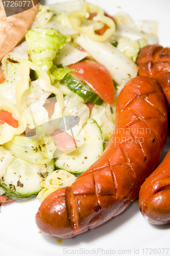 Image of debrecziner Hungarian sausage with salad