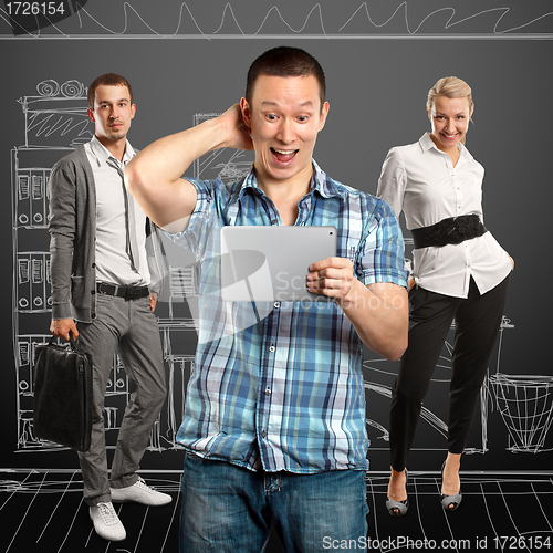 Image of Man With Touch Pad And Business Team 