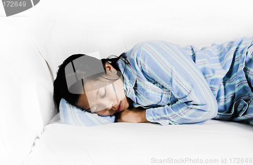 Image of woman sleeping on couch