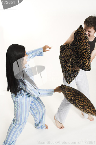 Image of couple fighting with pillows