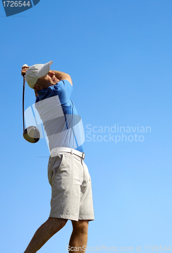 Image of 	golfer shooting a golf ball