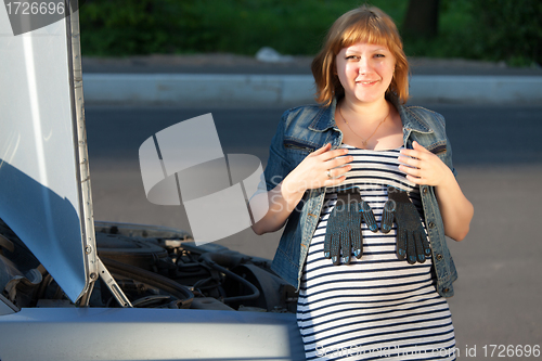 Image of Pregnant Woman Near the Broken Car 