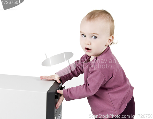 Image of young child playing with CD